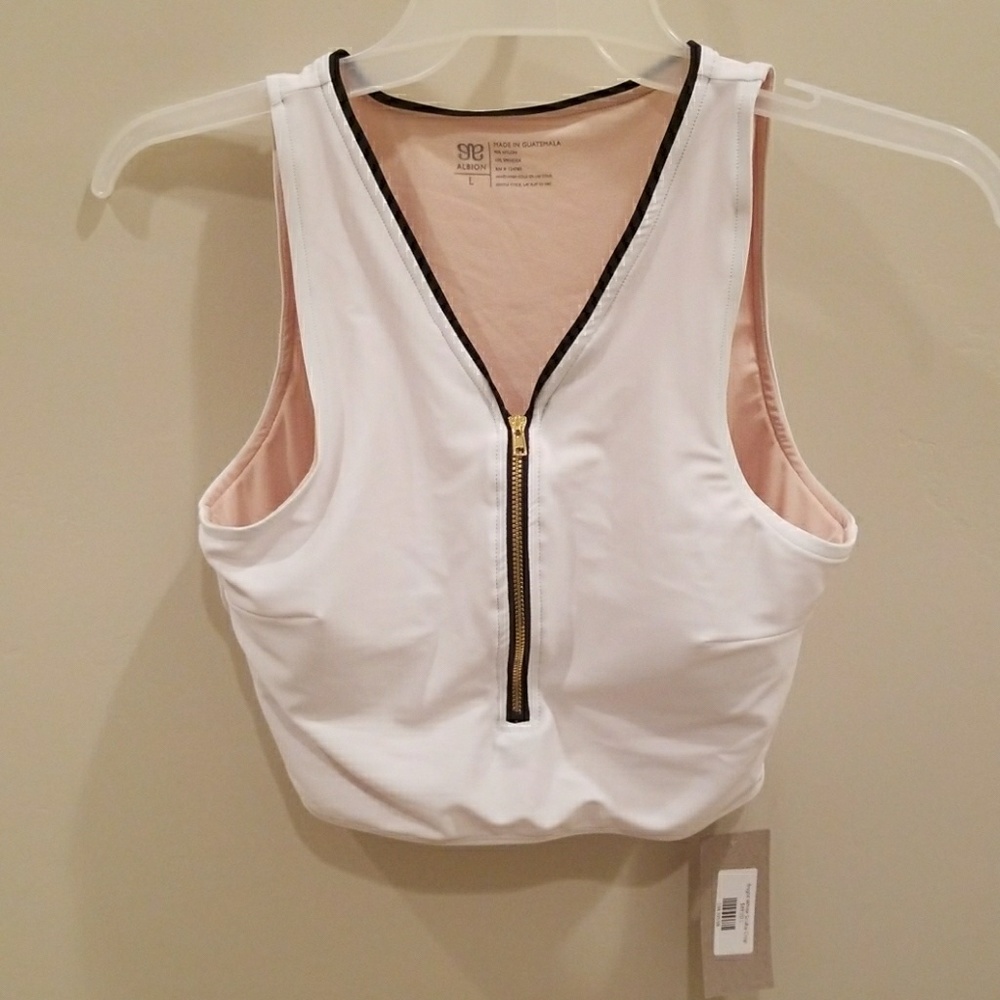 Brand new white zip-up Albion fit top.